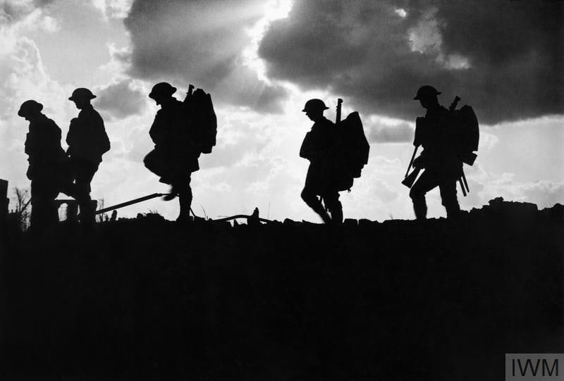 British soldiers silhouetted against the sky on the Western Front, 1917