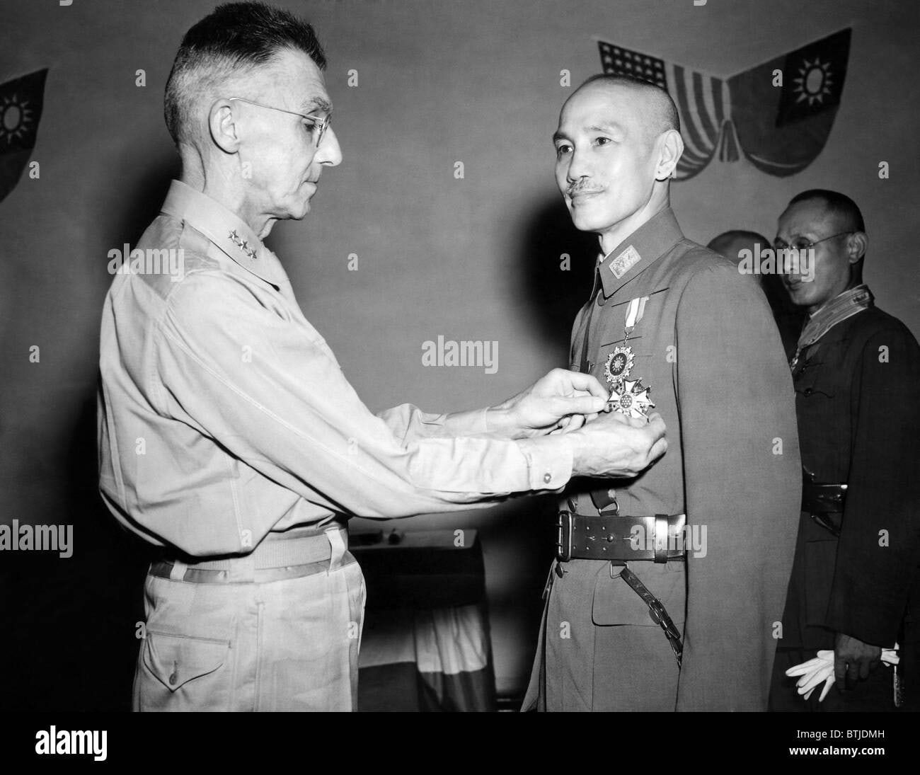 Lt-General Joseph Stilwell, US chief of staff to General Chiang Kai Shek, presents his boss with the Legion of Merit in 1943. The two men did not get on.