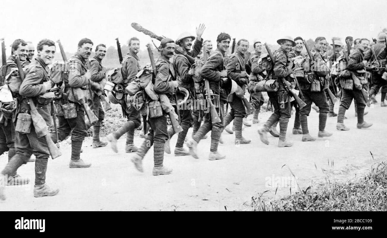 British soldiers of the East Yorkshire regiment smile at the camera as they make their way up to the Somme front, 3 July, 1916.