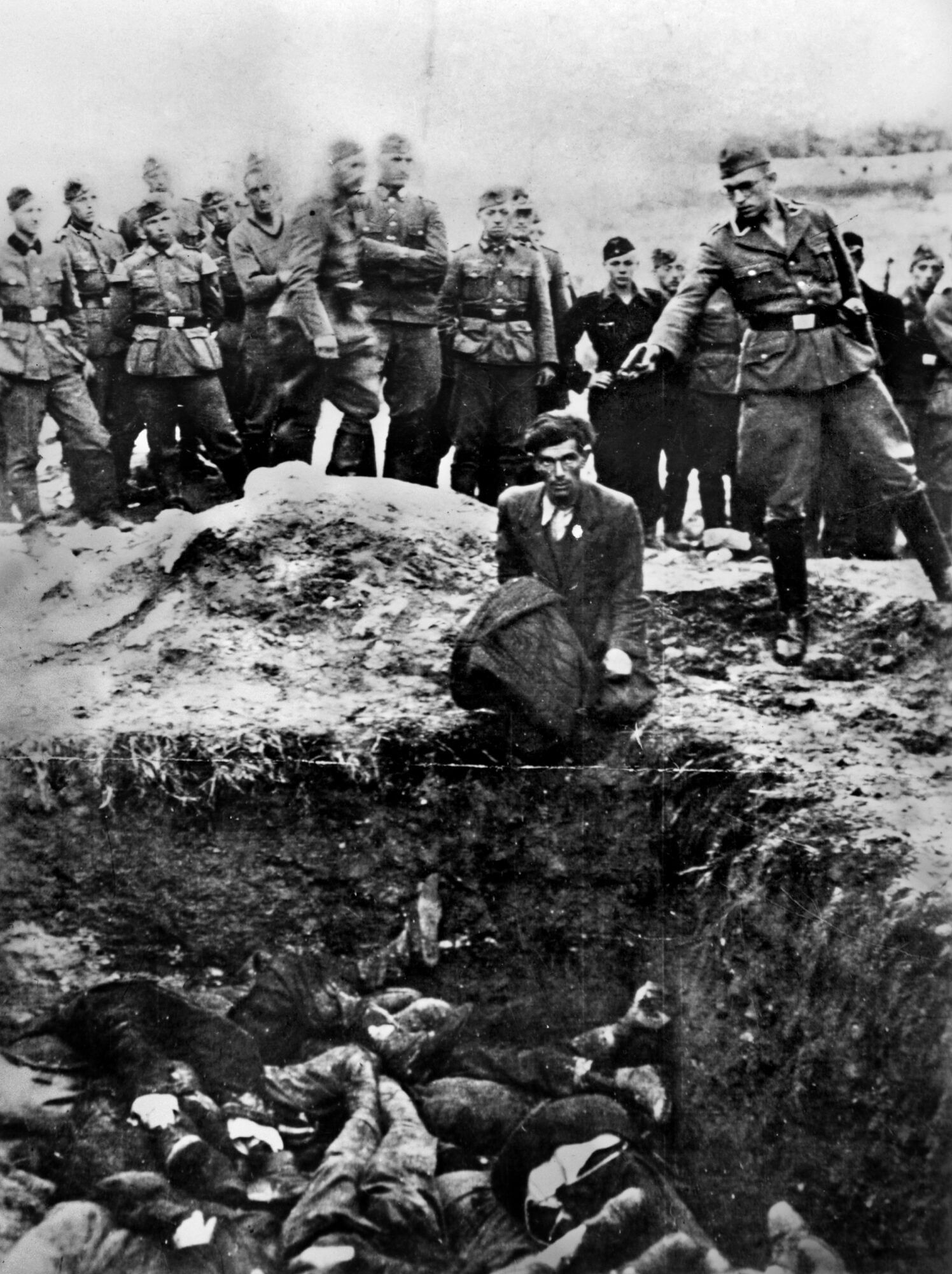 An Einsatzgruppe execution at the edge of a mass grave, Eastern Europe, c.1941–42